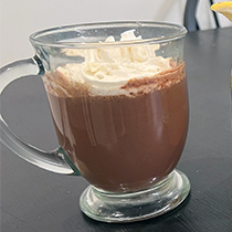 a mug of hot chocolate with whipped cream on top